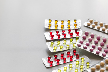 pills in blisters on white background