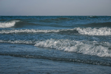 Sea waves with white foam