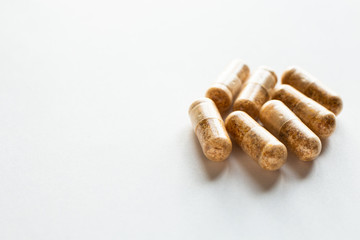 Vitamin pills on a white background