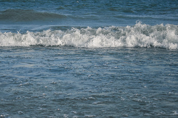 Sea waves with white foam