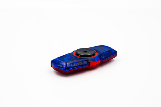 Blue and red fidget spinner - Powered by Adobe