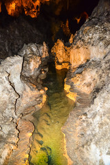 Calcite inlets, stalactites and stalagmites in large underground halls in Carlsbad Caverns National Park, New Mexico. USA