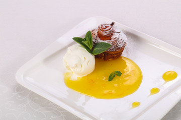 Tasty hot muffin with ice cream