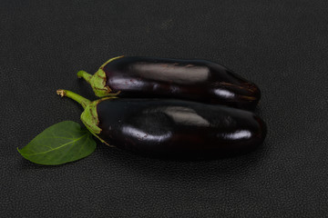 Ripe tasty Eggplant over wooden background