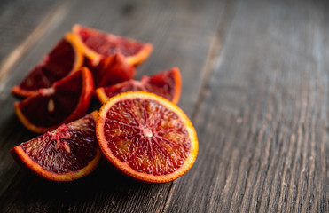 Ripe bloody oranges on the rustic background. Selective focus. Shallow depth of field.