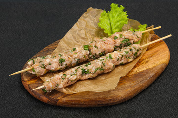Raw minced pork skewer kebab for grill
