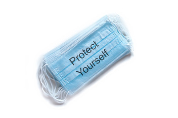 Medical mask PROTECT YOURSELF. Coronavirus COVID-19 pandemic. Medical protective masks isolated on...