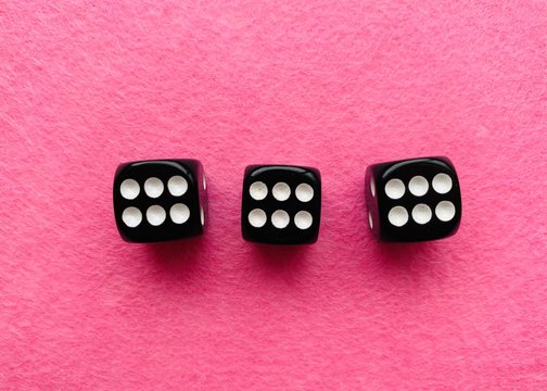 Black Dice On Pink Background 666