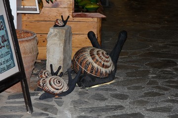 snail figurines on the street