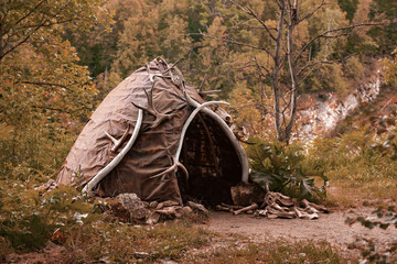Reconstruction of the human dwelling of the Stone Bronze Age. household items. archaeological...