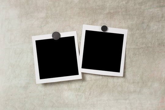 Blank polaroid photo frame with soft shadows and  magnet tape isolated on grey paper background as template for graphic designers presentations, portfolios etc. kids. magnetic board
