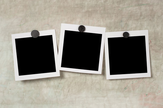 Blank polaroid photo frame with soft shadows and  magnet tape isolated on grey paper background as template for graphic designers presentations, portfolios etc. kids. magnetic board