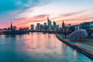 Fototapeta na wymiar Sunset over Frankfurt skyline, view from riverside