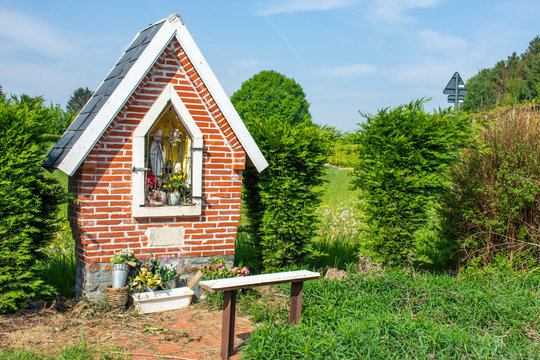 Small Holy Mary chapel in the fields  with bench, in Overijse, Flanders, Belgium,