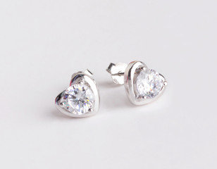 A pair of beautiful 925 sterling silver earrings in heart shape isolated
