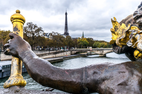 view of the Eiffel tower from far away with a statue