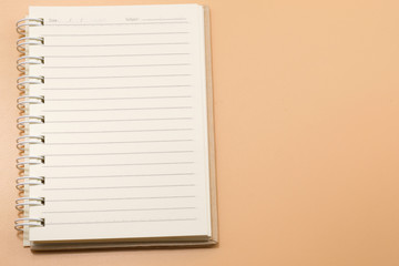 spiral notebook on Brown background
