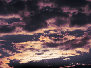 Dark sky with heavy and rainy clouds.