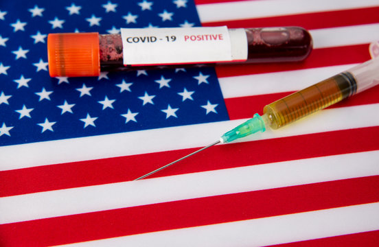 covid19 vaccine and blood sample on united states flag