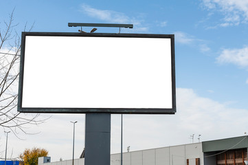 Blank white advertising billboard in the city