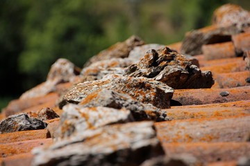 Stones on a roof and out of focus in the foreground