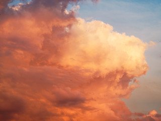 Beautiful cloud at sunset. Red-orange sky. Fiery clouds.