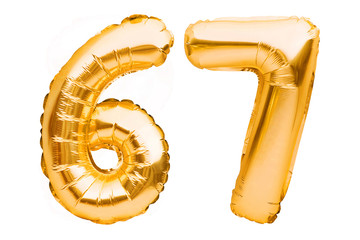 Number 67 sixty seven made of golden inflatable balloons isolated on white. Helium balloons, gold...
