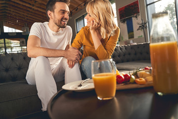 Lovely young couple sitting on the sofa