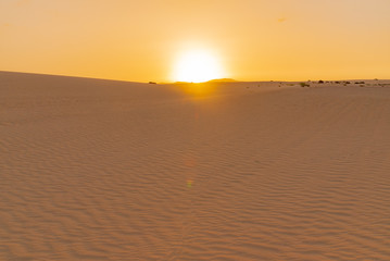 Fototapeta na wymiar Sunset over the sand dunes, Canary Island of Fuerteventura