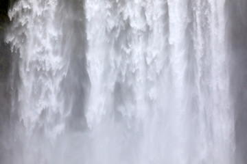 Skogafoss / Iceland - August 15, 2017: Beautiful and famous Skogafoss waterfall in South of Iceland, Iceland, Europe