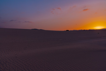 Obraz na płótnie Canvas Sunset over the sand dunes, Canary Island of Fuerteventura