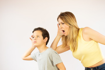Mother and son making listening gesture