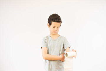 Boy with a roll of toilet paper