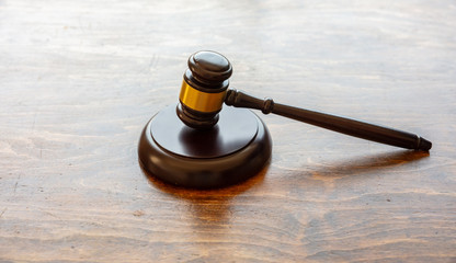 Judge gavel on wooden background, closeup view. Law, auction concept