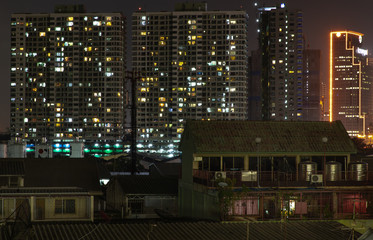 Fototapeta na wymiar House and Building in Bangkok downtown at night.