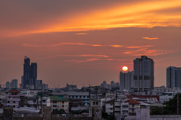 Fototapeta premium Skyscrapers Bangkok City in the light of the setting sun silhouetted cities at sunset.