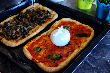Preparing homemade italian pizza, homemade burrata pizza