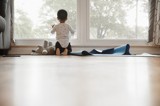 Toddler bored at home during quarantine  with copyspace