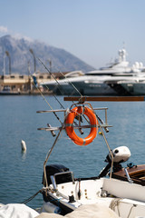 The lifeline is mounted on a motorboat. Fishing rods