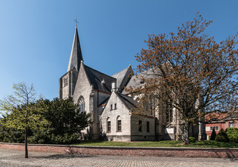 Fototapeta na wymiar Side view of the gothic parish church in the city centre of Heist-op-den-Berg, Belgium
