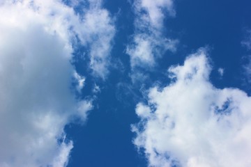 Beautiful Blue Sky Background With White Clouds. Air clouds in the blue sky.Blue backdrop in the air. Abstract style for text, design, fashion, agencies, websites, bloggers, publications.
