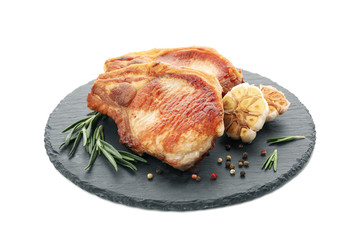 Tray with fried pork steaks isolated on white background. Grilled food