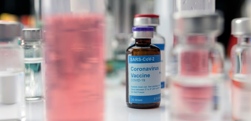 Coronavirus covid-19 experimental vaccine in a laboratory, conceptual image