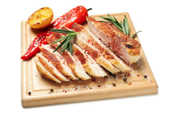 Board with chopped pork steak isolated on white background