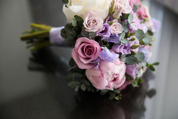 wedding bridal bouquet on a glossy surface

