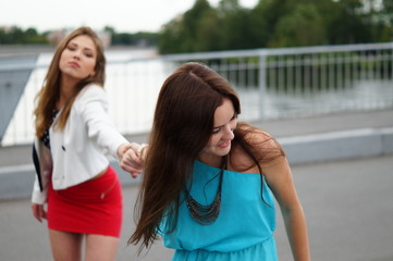Lesbians are roaring each other. Same-sex love. Female friendship and hatred. Two beautiful girls...