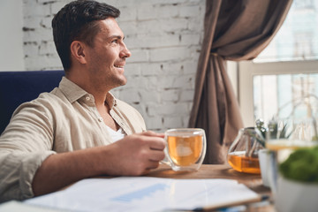 Joyous telecommuter taking a break from work