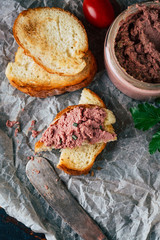 Delicious homemade liver pate on a slice of wheat toast