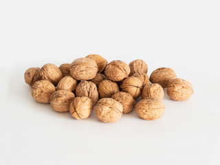 A group of walnuts on white background
