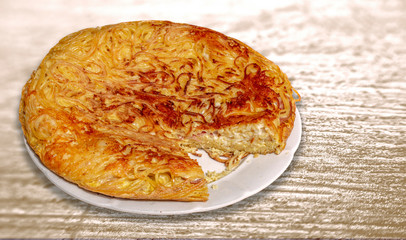 Macaroni pizza on the plate